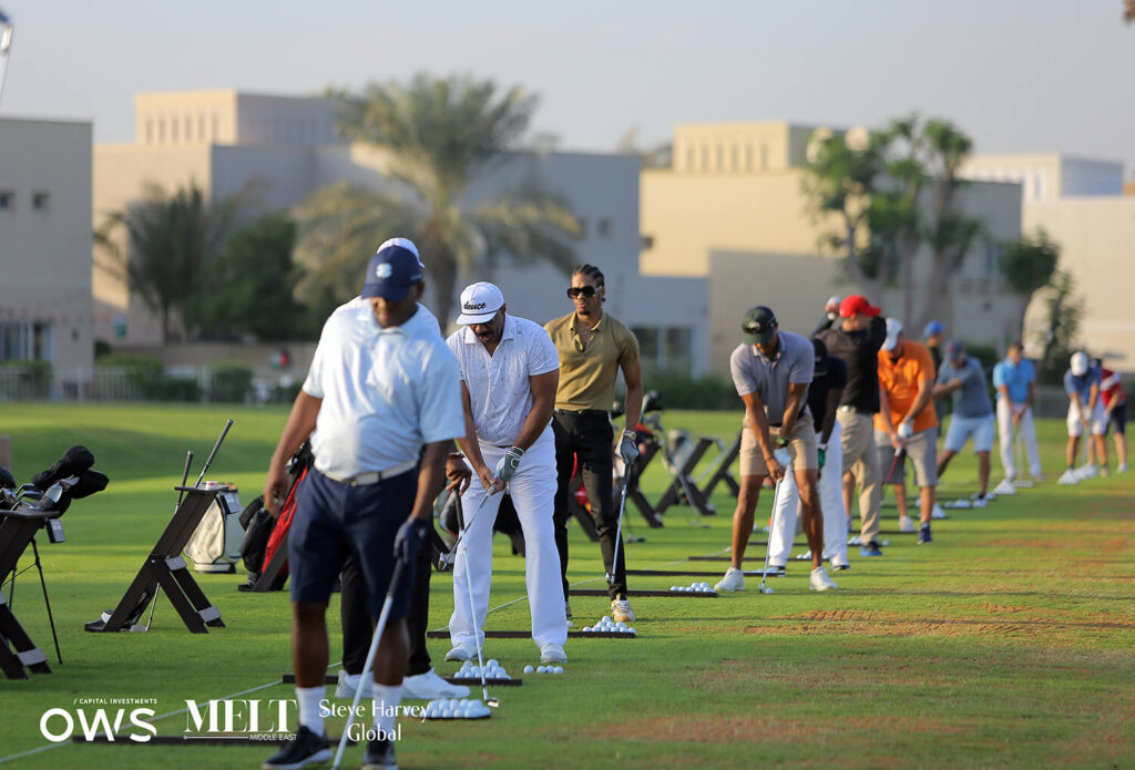 Participants lined up to practice their swings