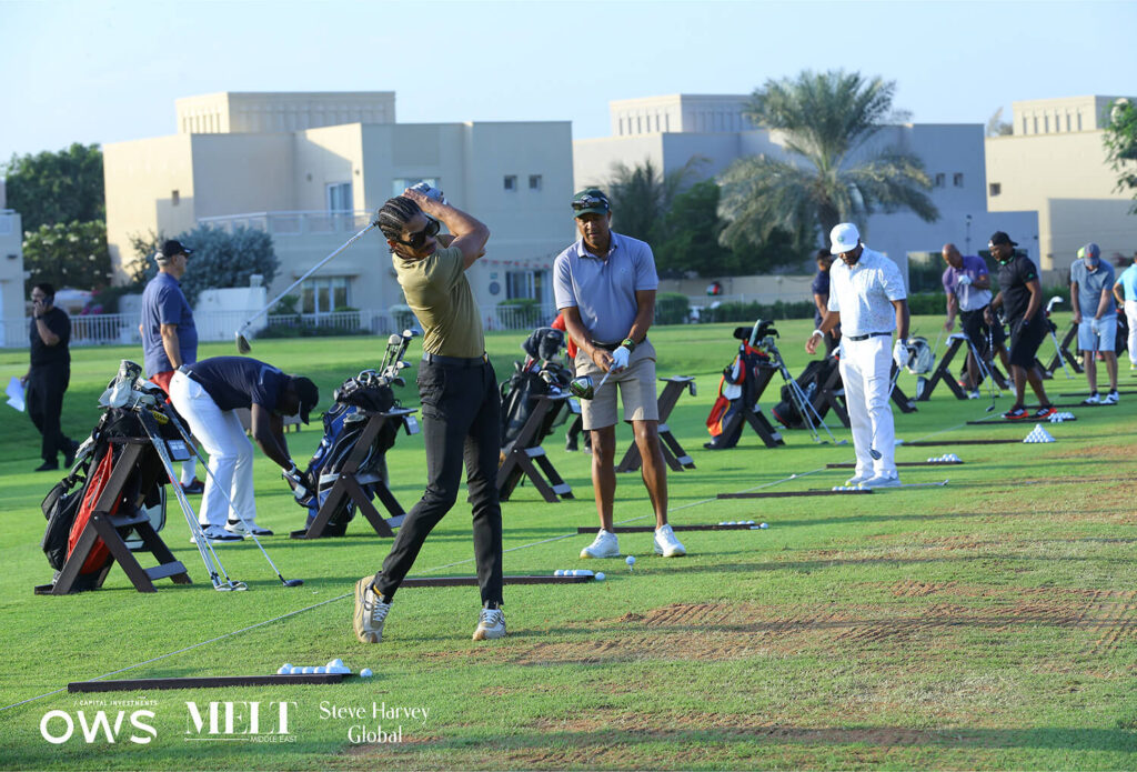 Golfers lined up to practice their swings
