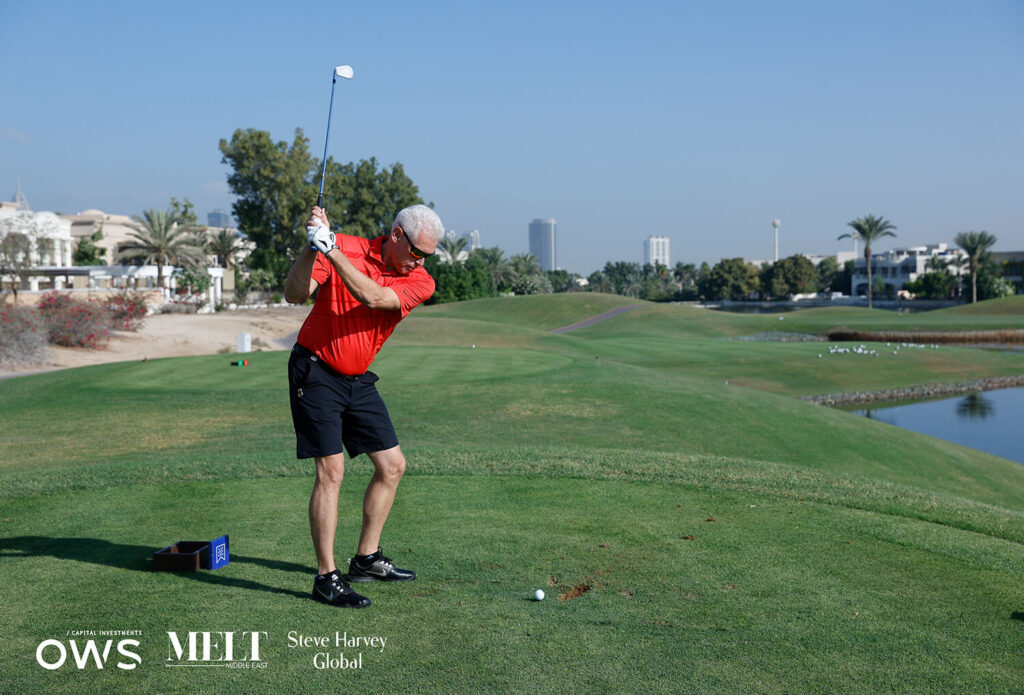 Golfer mid swing