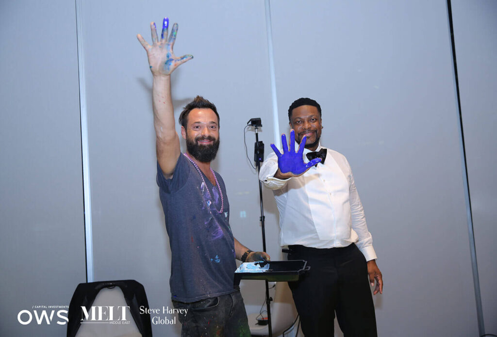 guest and artist with painted hands