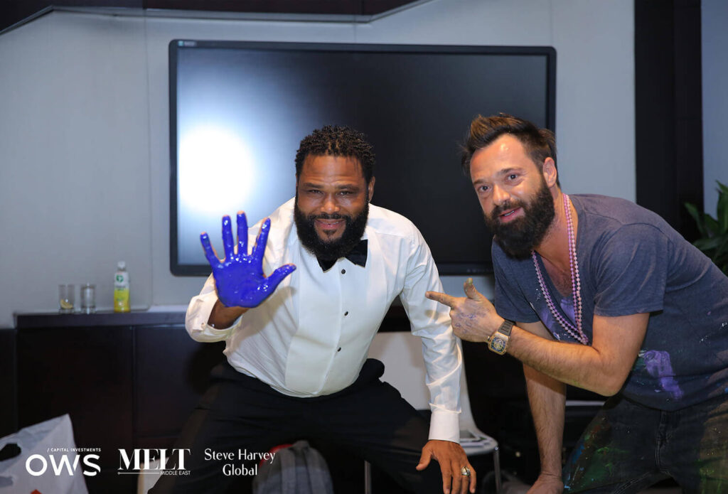 guest and artist with painted hands