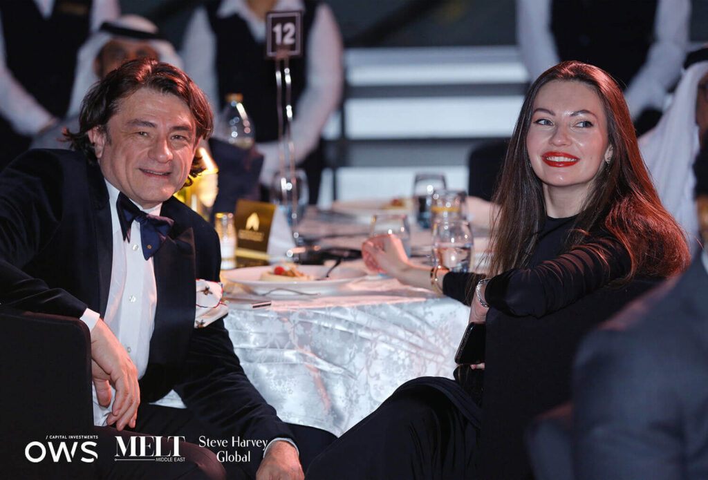 Guests at table smiling