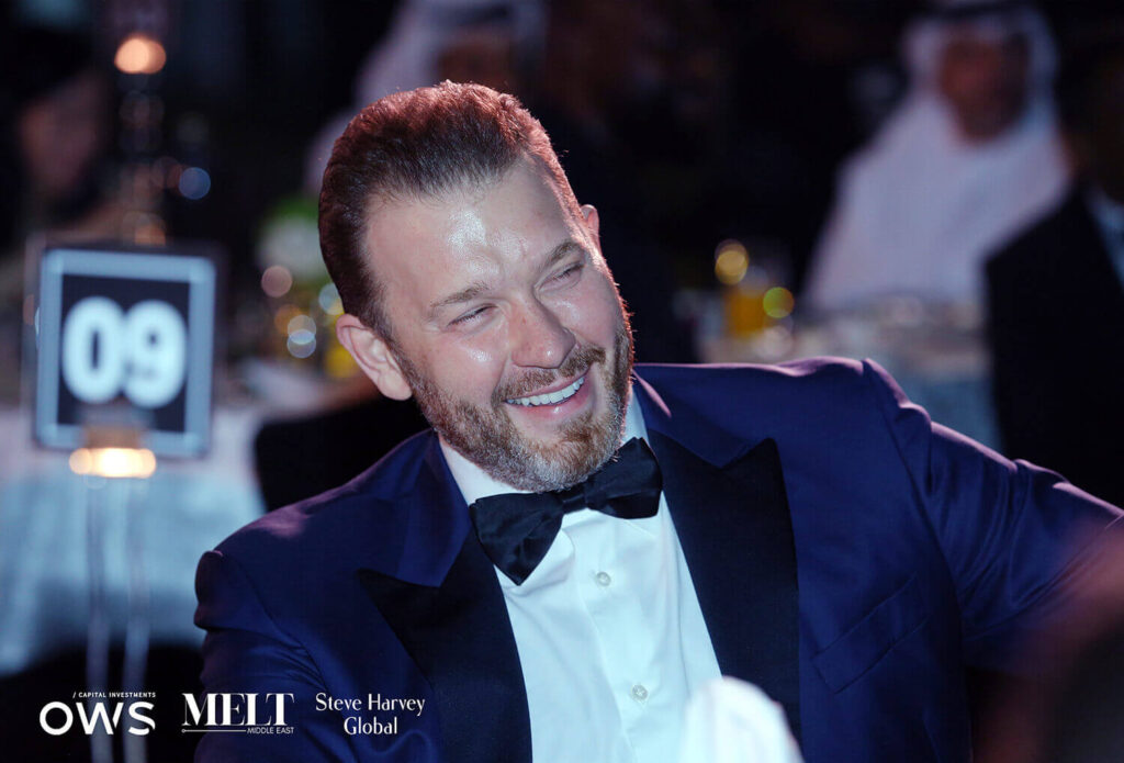 Guest laughing at his table