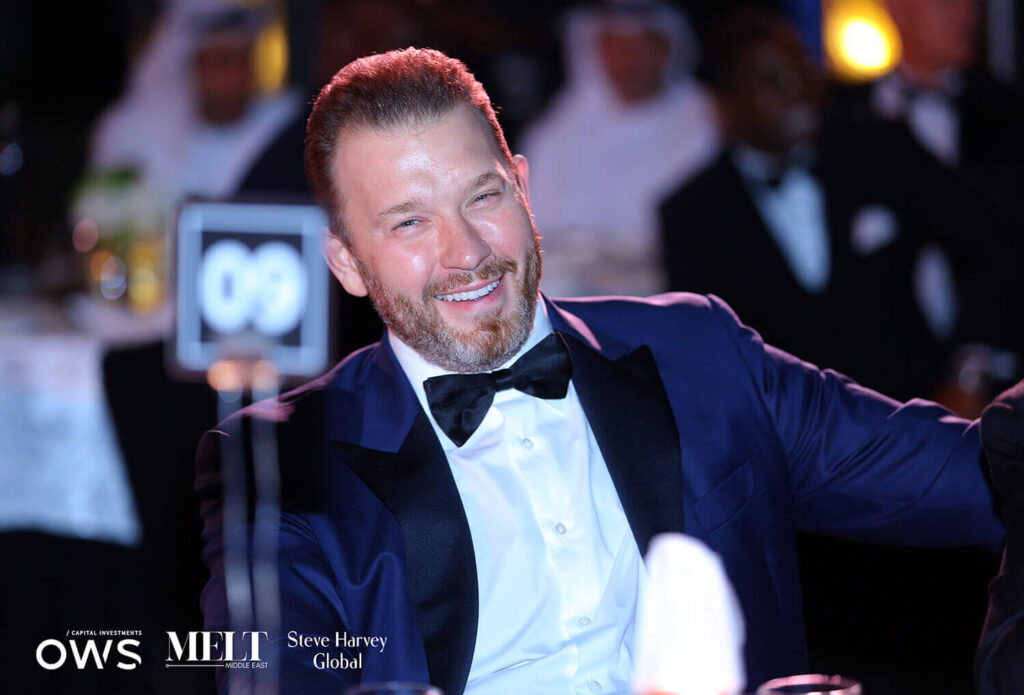 Guest laughing at his table