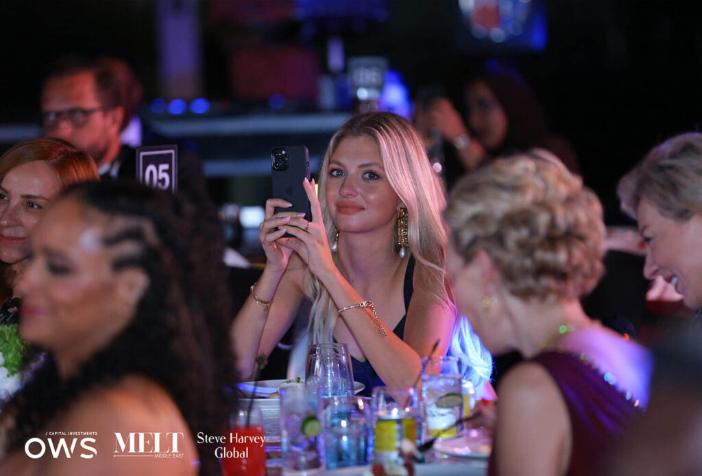 Guest taking a picture from her table