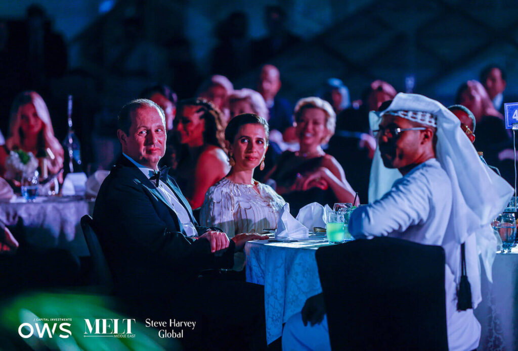 Guests at their dinner tables