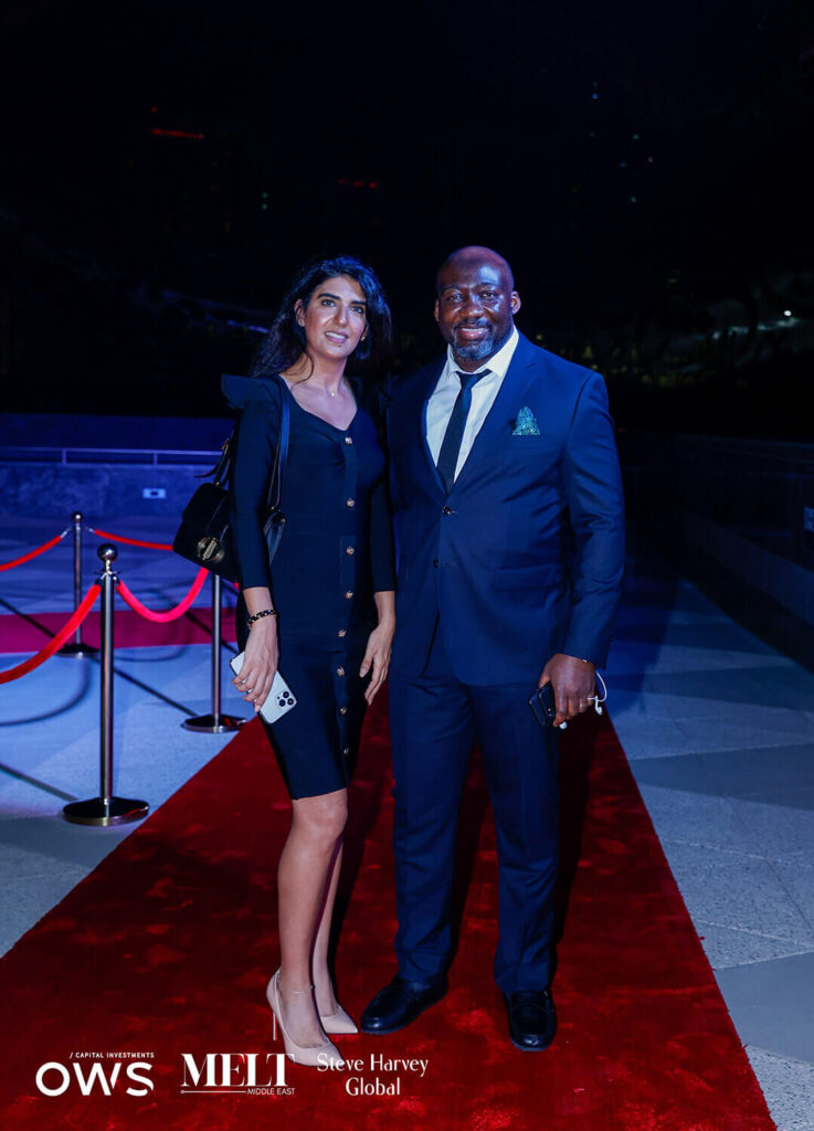 Guests pose on red carpet
