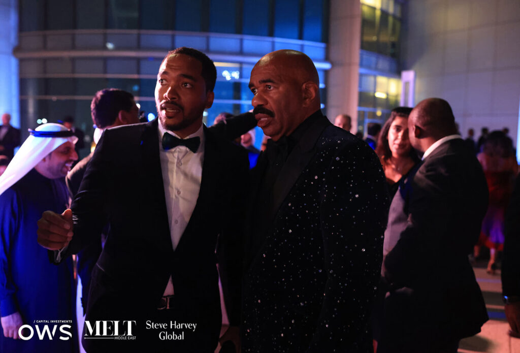 Gentlemen talking to Steve Harvey