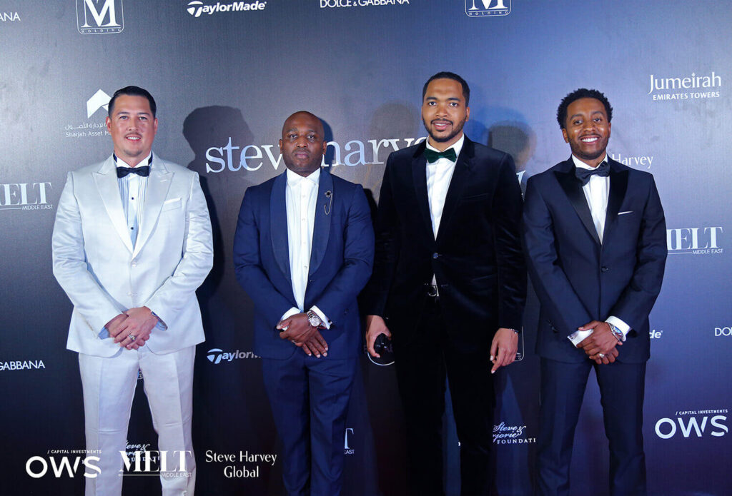 Guests posing on red carpet