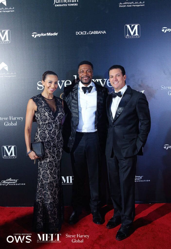 Guests posing on red carpet