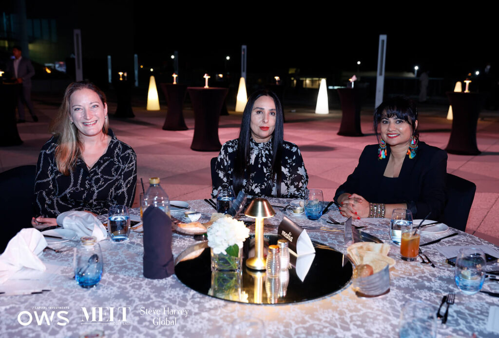 Guest posing for a picture at dinner table
