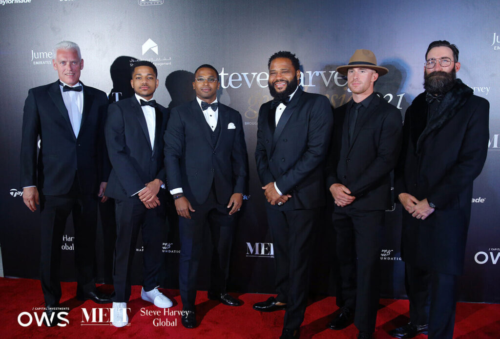 Guests posing on red carpet