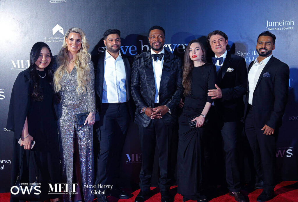 Guests posing on red carpet