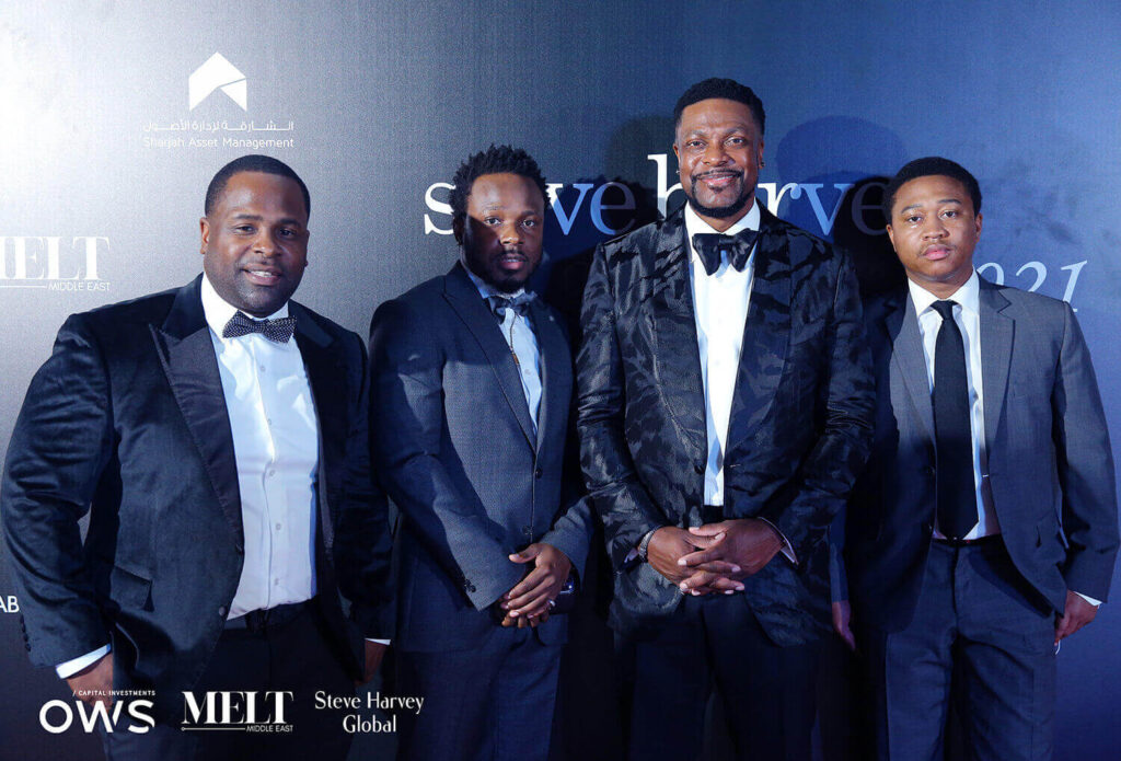 Guests posing on red carpet